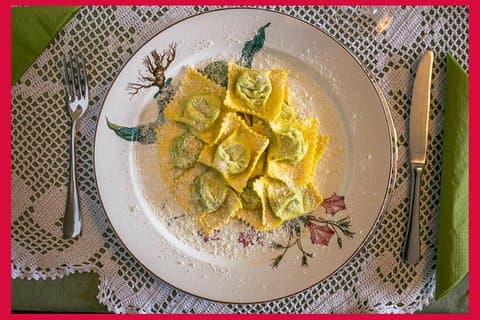 Dining experience at a local's home in Parma with show cooking