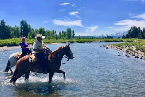 Horseback ridning med Grand Teton utsikt i Jackson Hole
