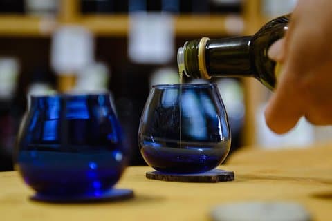 Tasting of extra virgin olive oil in the shop