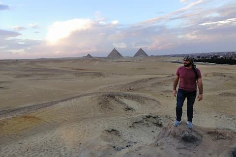 Sunset at Giza pyramids by camel