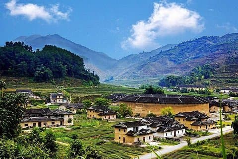 Traslado privado entre la ciudad de Xiamen y el Edificio de la Tierra de Hua