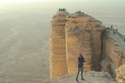 Edge of the World with 4x4 vehicle, camels and stargazing