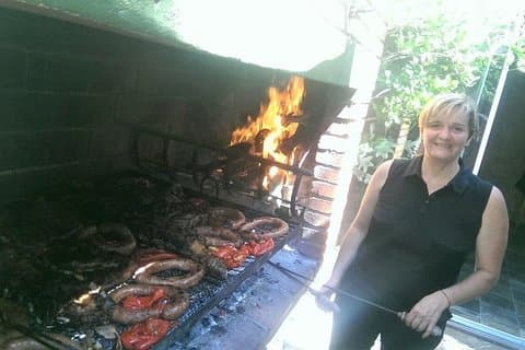 Montevideo tour offered by a family sharing a home babecue lunch