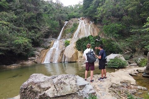 Natural adventure with waterfalls, trails and sunny day
