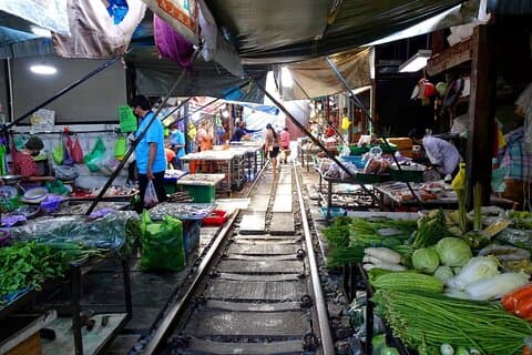 Meet Thai locals and tour Maeklong Railway Market with lunch