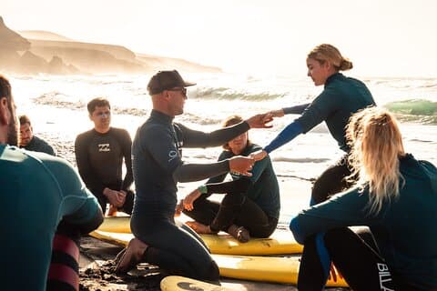Learn to surf on the endless beaches in southern Fuerteventura