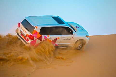 Abu Dhabi Evening Desert Safari - Dune bashing Camel ride and BBQ