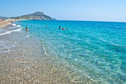 Toppattraksjoner på Rhodos inkludert fritid på stranden.