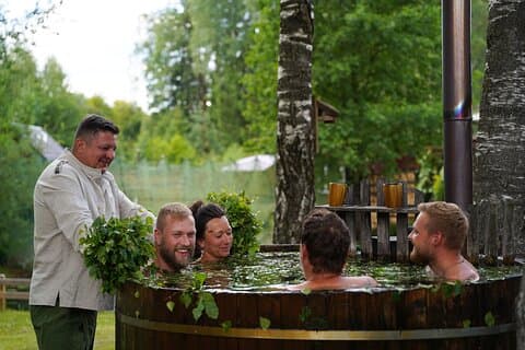 Traditional Latvian wet sauna ritual with herbal Hot-Tub