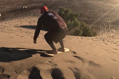 Slide into the sunset by Sandboarding in Las Dunas Del Mogote