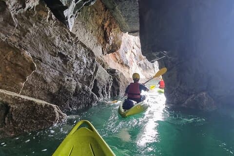 Guided kayaking trip exploring the secrets of the Tenby coastline