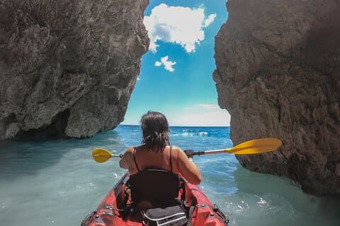 Kayaking excursion in Porto Miggiano among the sulfur caves
