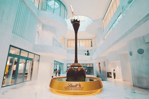 Zurich: Private Lindt Home of Chocolate Tour with Pickup & Photos