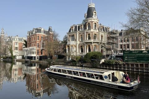 Amsterdam Scalo: Tour a piedi e crociera sui canali + trasferimento aeroportuale