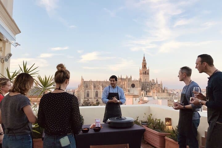 Seville: Small Group Rooftop Paella Class with Sangria Pairing