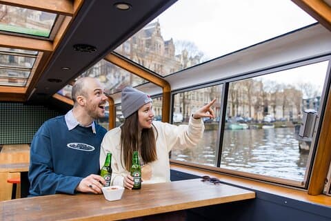Amsterdam: Heineken Canal Cruise + Drinks & Live Guide